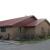 Rustic Red Metal roof behind Snoball Express in El Campo, TX